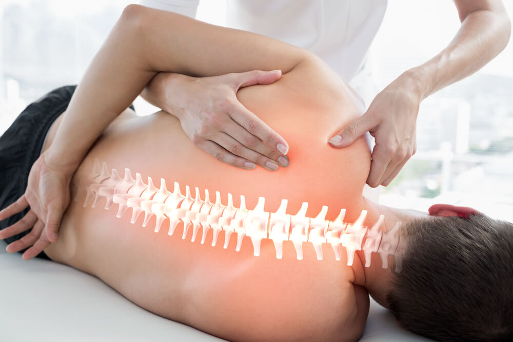 Digital,Composite,Of,Highlighted,Bones,Of,Man,At,Physiotherapy
